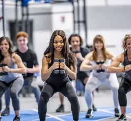 A group of women exercising together in a group exercise class.