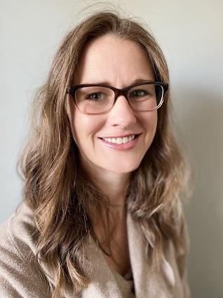 A portrait of Megan Kraskouskas, a registered dietician affiliated with the Ragsdale YMCA. She is wearing glasses and smiling at the camera.