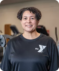 A portrait of Melinda "Mo" Summers, personal trainer at the Reidsville YMCA. She is smiling at the camera.