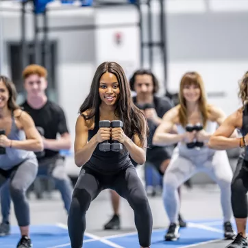 A group of women exercising together in a group exercise class.