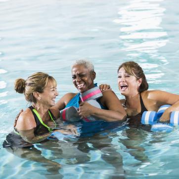 A group of women enjoying a water fitness class.