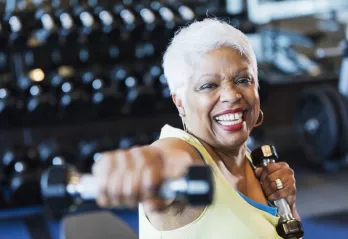 senior woman exercising with weights
