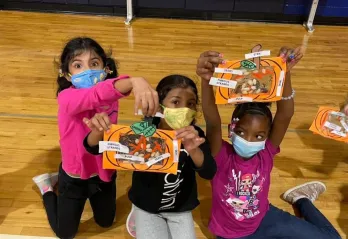 Girls participate in Thanksgiving crafts in the YMCA afterschool program.