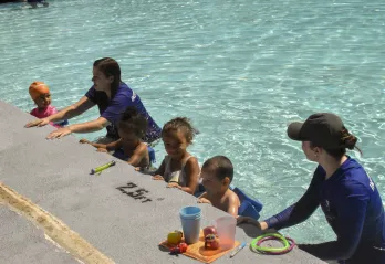 youth swimming in pool