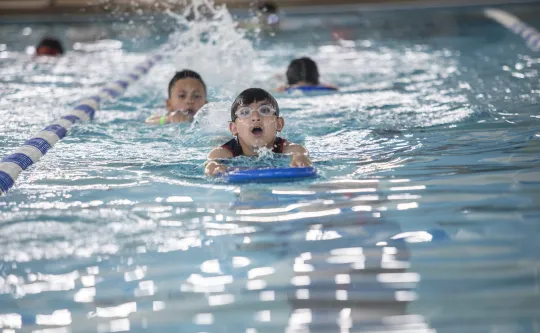 A group of children in a swim lessons class at the Ragsdale YMCA.