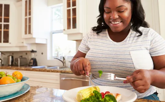 Woman eating a balanced meal