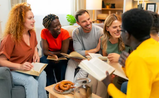 A group of people sitting together in a Bible study group.