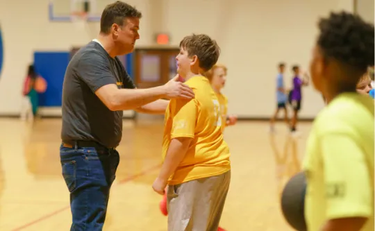 Coach volunteer and youth basketball player at Spears Family YMCA