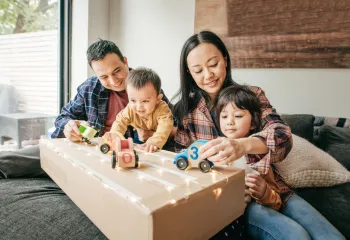 A family sitting and playing together.