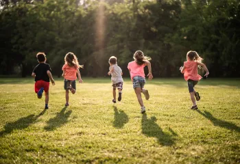 A group of children running.