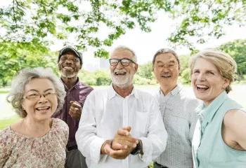 A diverse group of seniors spending time together outside.