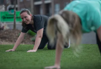 Woman doing Yoga in park with Y in the Community at YMCA of Greensboro