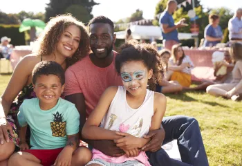 A family having fun together at an outdoor summer event.