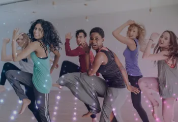 Group of six participating in an upbeat zumba class