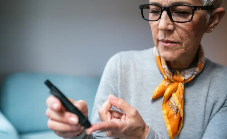 Woman doing diabetes blood test at home