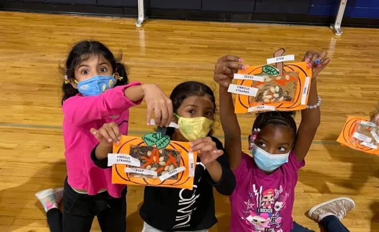 Girls participate in Thanksgiving crafts in the YMCA afterschool program.