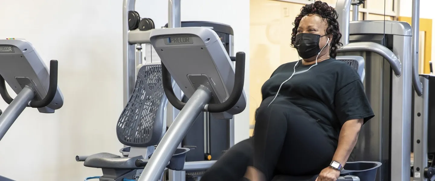 A woman working out using a stationary bike at the Hayes-Taylor YMCA.