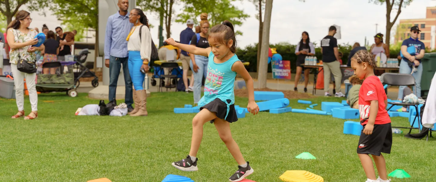 Child playing lawn games at Healthy Kids Day 2024