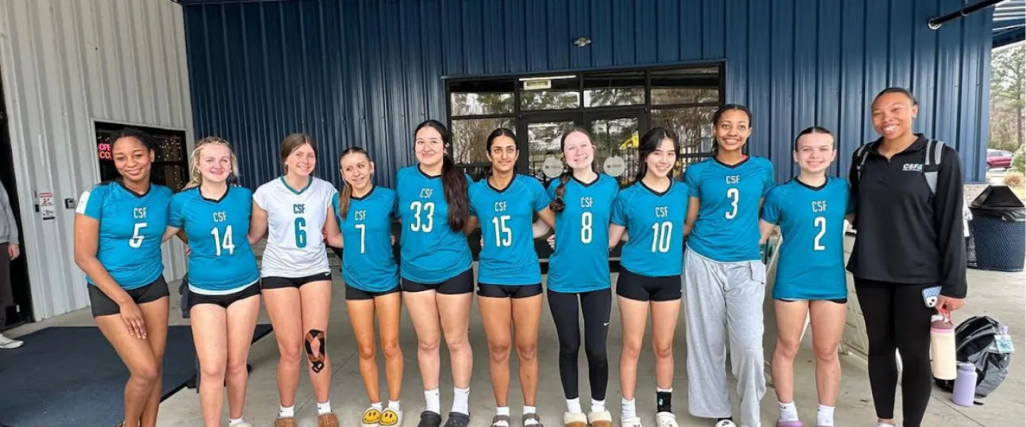 Carolina Spike Force volleyball athletes group photo with coach
