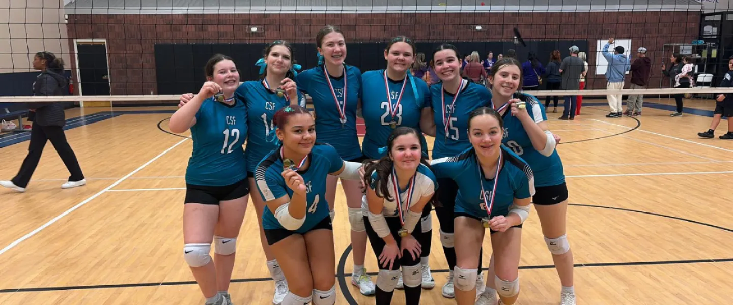 Carolina Spike Force volleyball athletes group photo with medals