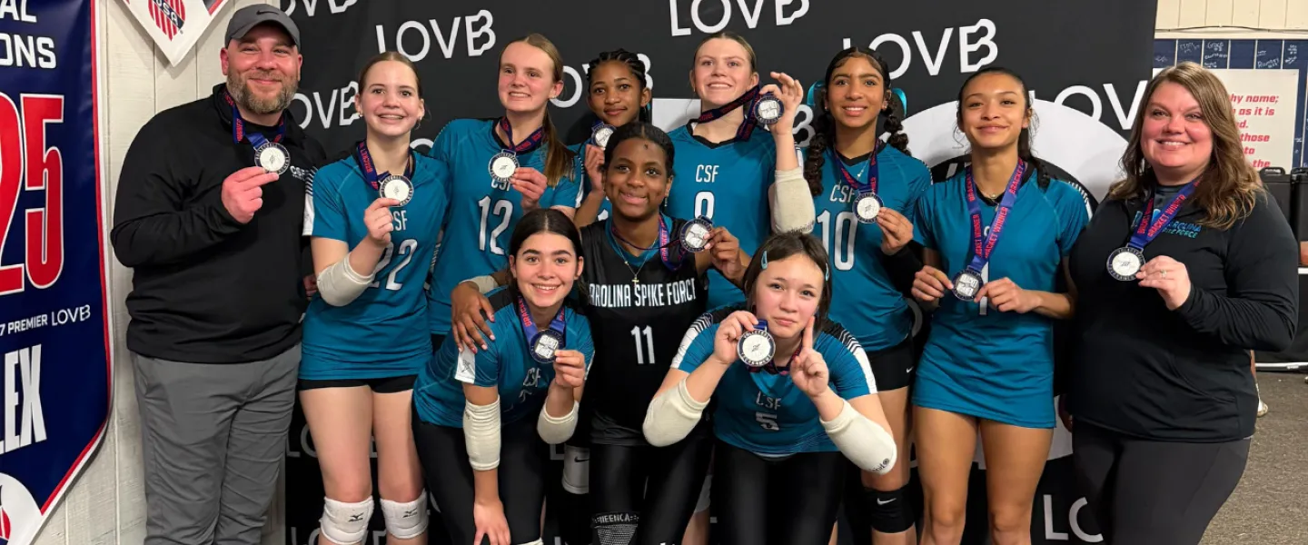 Carolina Spike Force volleyball athletes group photo with medals