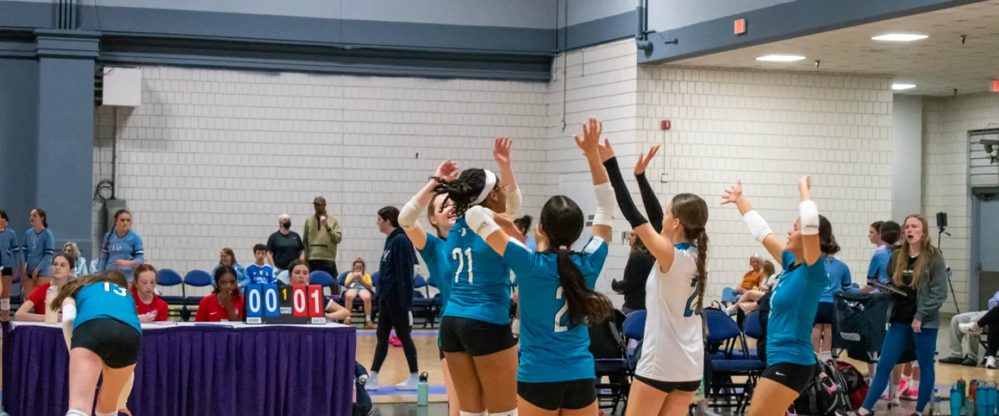Carolina Spike Force volleyball athletes celebrating ACE