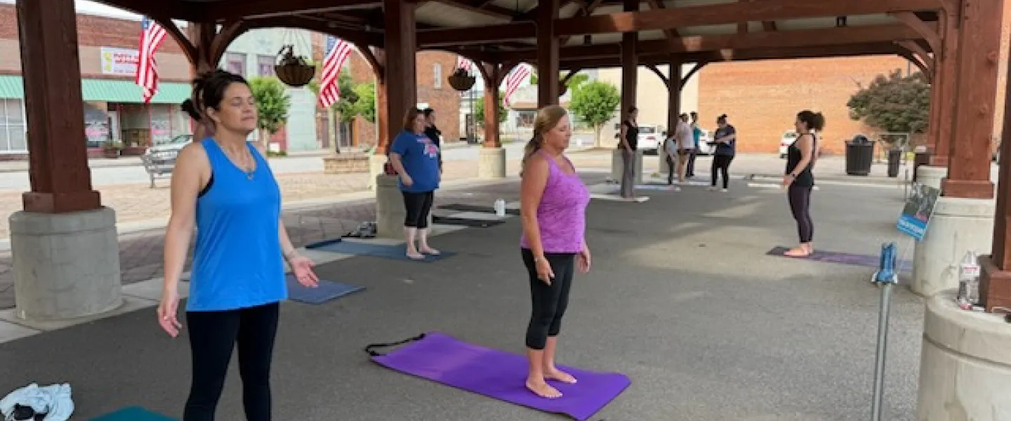 Group of people doing Yoga in the Square in Reidsville