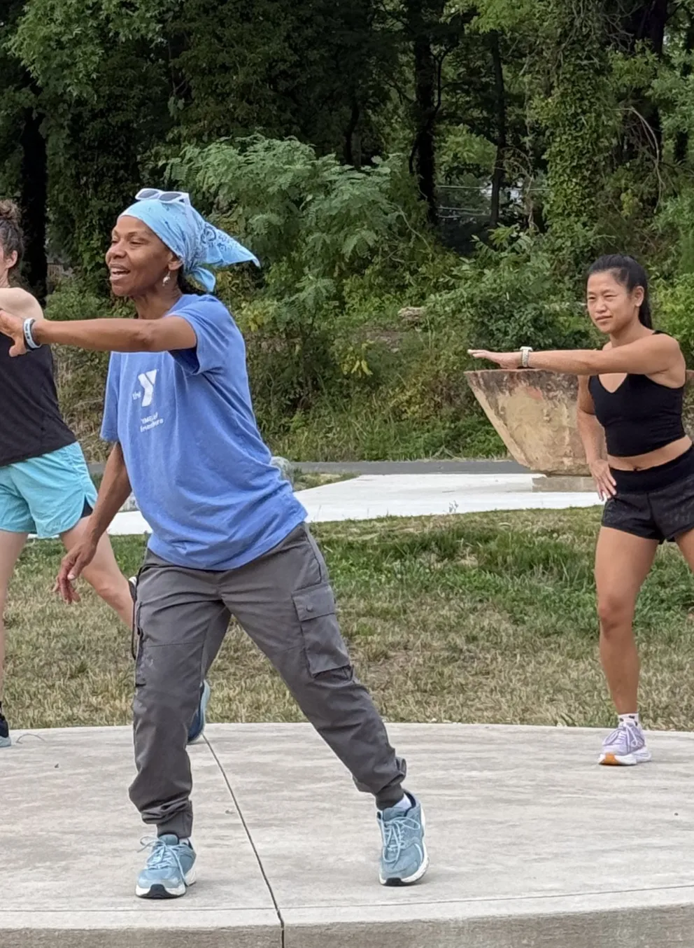 Three people working out along the Greenway in Greensboro