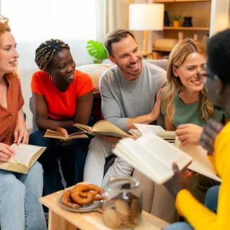 A group of people sitting together in a Bible study group.