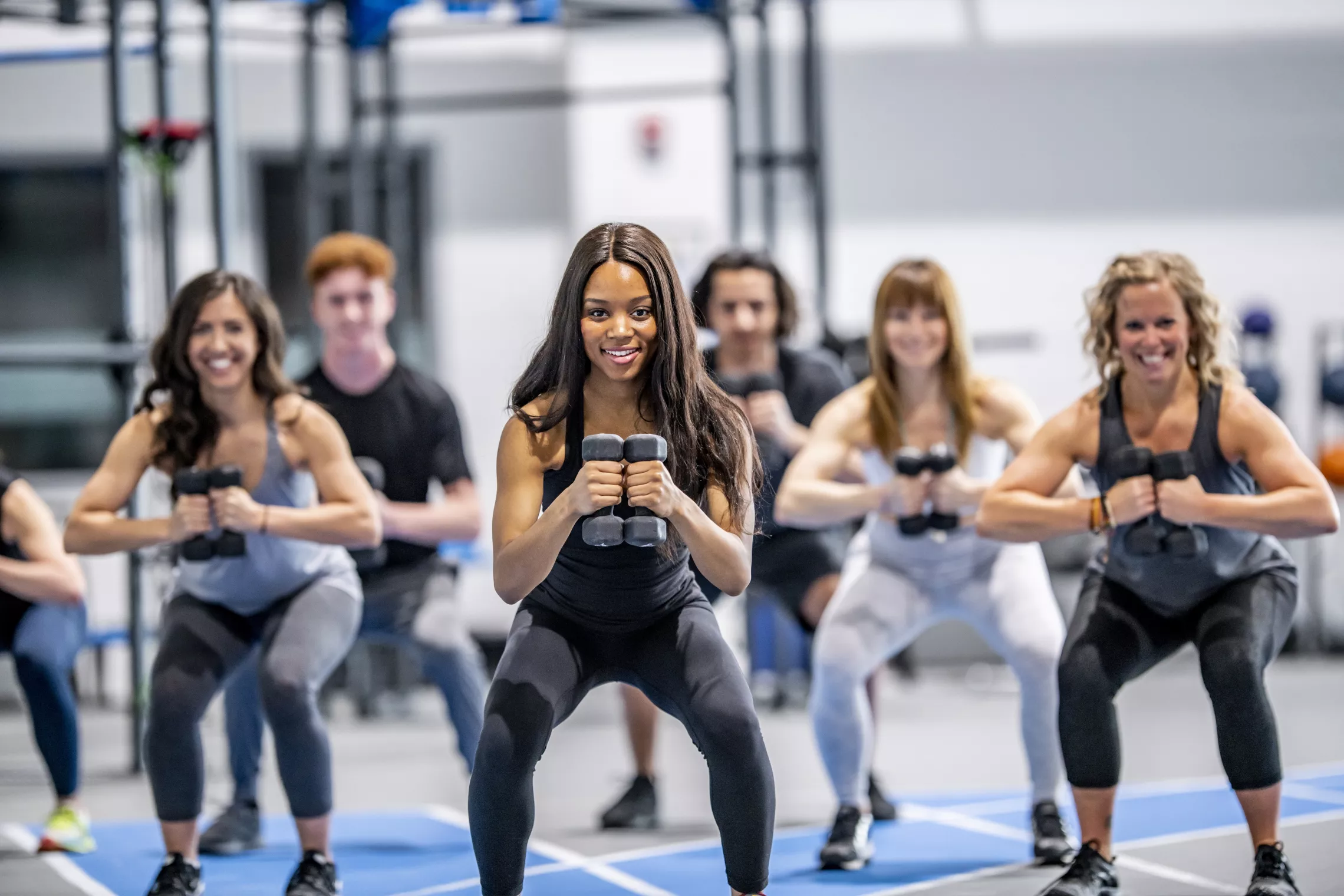 A group of women exercising together in a group exercise class.