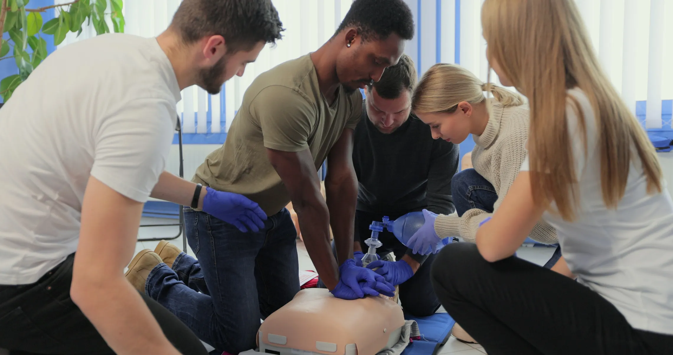 A diverse group of students at a CPR class.