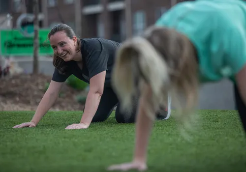Woman doing Yoga in park with Y in the Community at YMCA of Greensboro