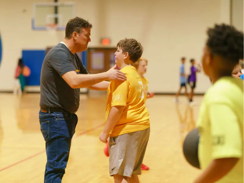 Coach volunteer and youth basketball player at Spears Family YMCA