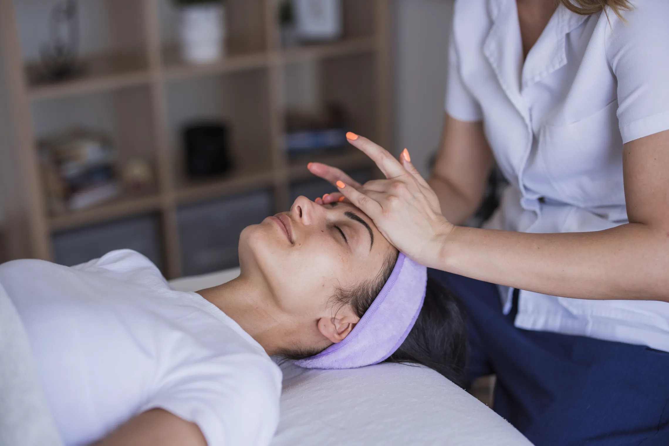 A woman receiving a massage in a massage therapy session.