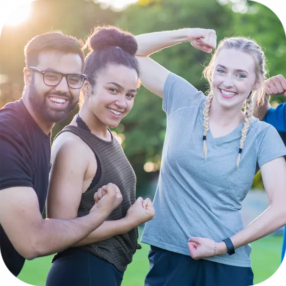 Friends flexing their arms.