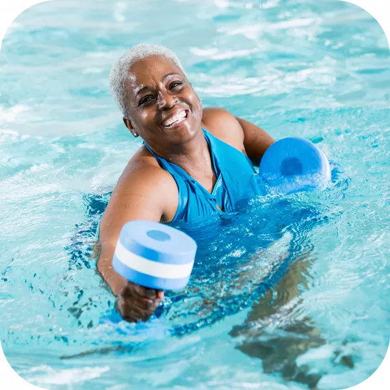 Female enjoying water exercise at the Y. 