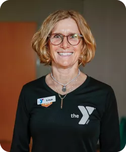 Lisa Barefoot, a personal trainer at the Bryan Y. She is wearing glasses and smiling at the camera.