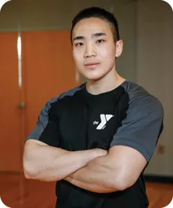 Toby Park, a personal trainer at the Bryan Y, smiles at the camera.
