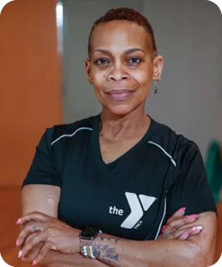 'Cee' Duncan, a personal trainer at the Bryan Y, smiles at the camera.