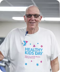 A photo of Jerry Davis, personal trainer at the Eden YMCA. He is wearing glasses and smiling at the camera.