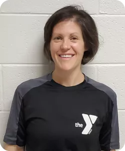 A portrait of Caroline Duncan, a personal trainer at the Spears Y. She is smiling at the camera.