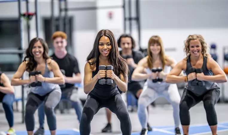 A group of women exercising together in a group exercise class.