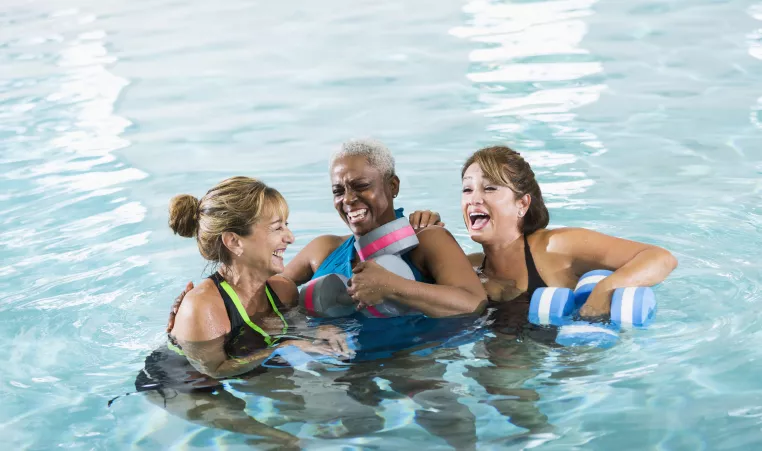 A group of women enjoying a water fitness class.