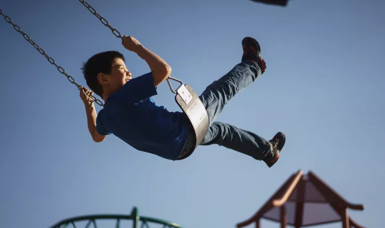 Child on a swing.