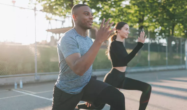 Couple working out outdoors