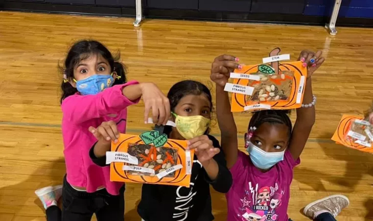 Girls participate in Thanksgiving crafts in the YMCA afterschool program.