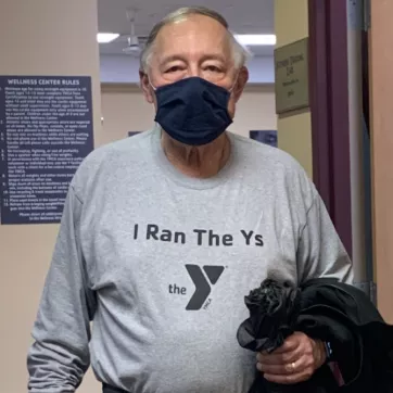 man holds jacket at the y