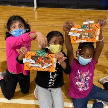 Girls participate in Thanksgiving crafts in the YMCA afterschool program. 