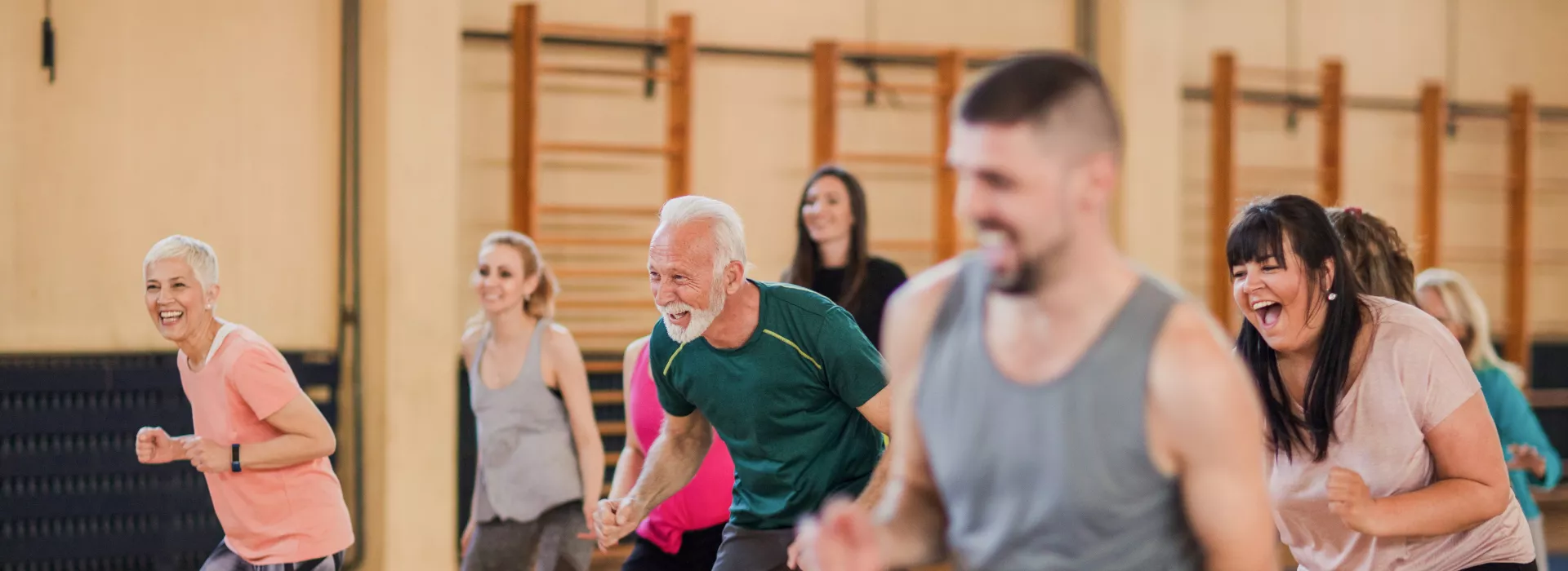 A smiling and happy group of people dancing.
