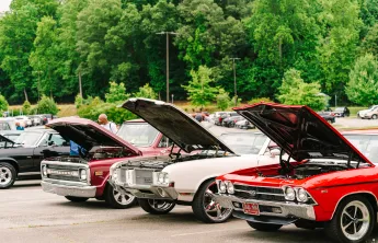 Cars lined up at a car show